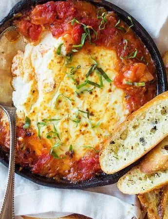 Baked goat cheese and marinara with toasted bread